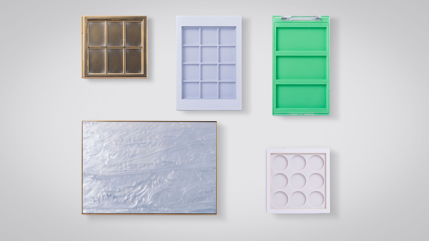 Cosmetic containers in customizable sizes and decorative finishes for diverse beauty products.