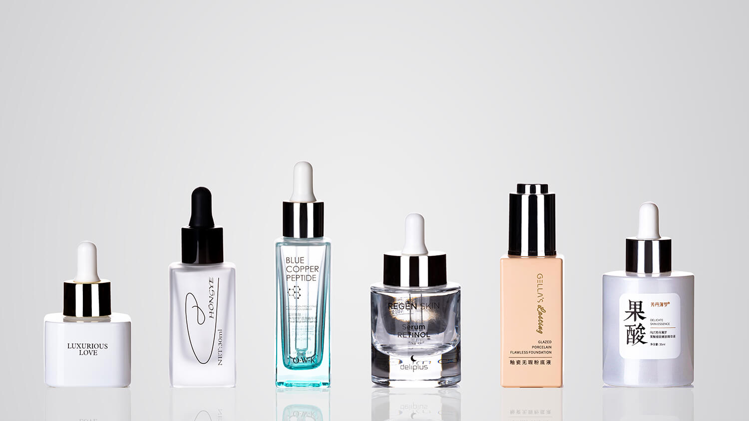 Clear glass dropper bottles available in multiple sizes, cap styles, and custom mold options.