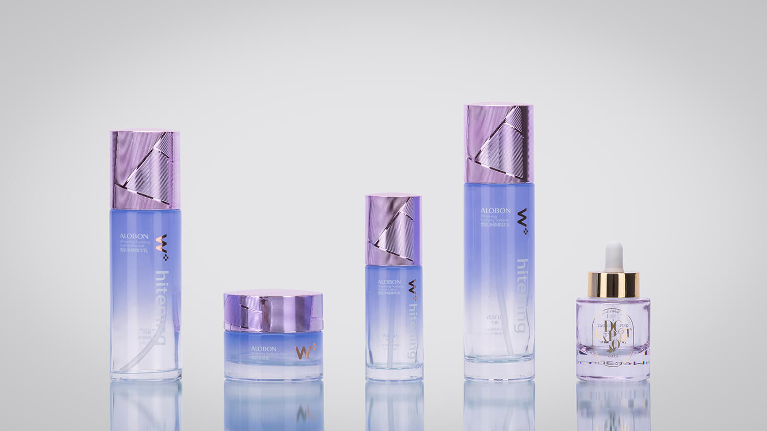 Cosmetic bottles and jars with metallized caps and advanced decoration.