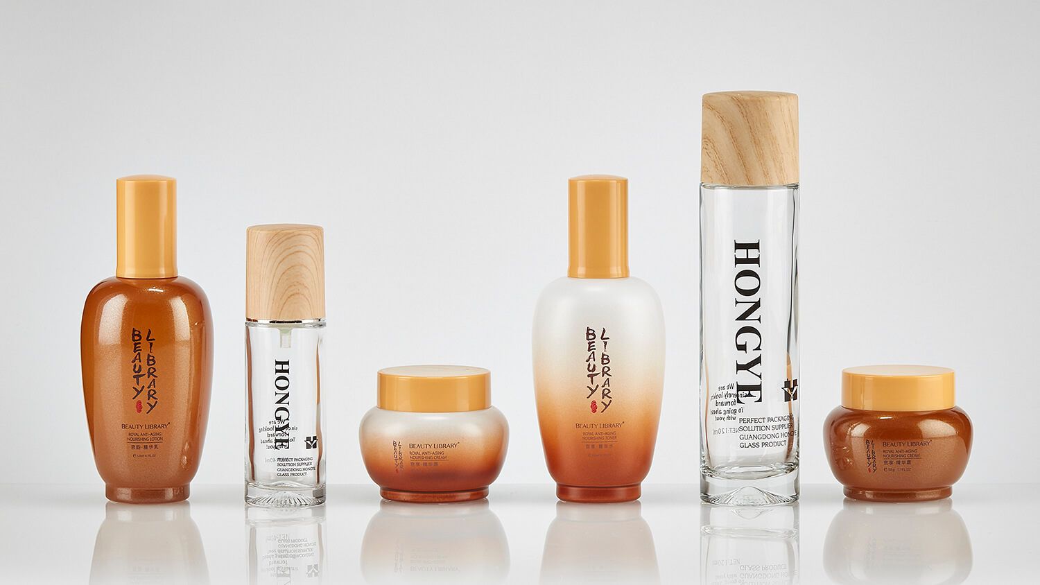 Custom cosmetic bottles for Beauty Library with water-transfer decoration.