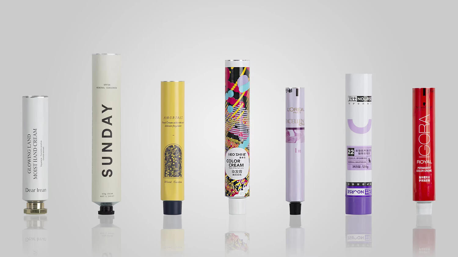 Custom printed aluminum tubes for personal care with L’ORÉAL, Sunday, and Dear Irean branding.