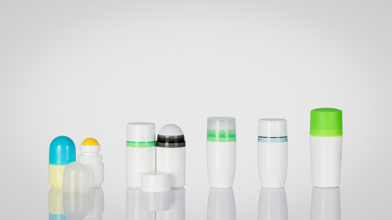 Plastic roll-on bottles with assorted lids, molds, colors, and sizes.
