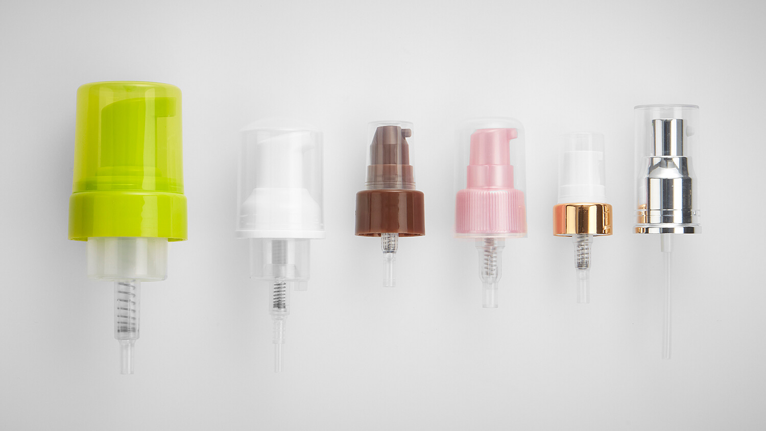 Treatment pumps in custom sizes and colors, including white, green, and pink options.