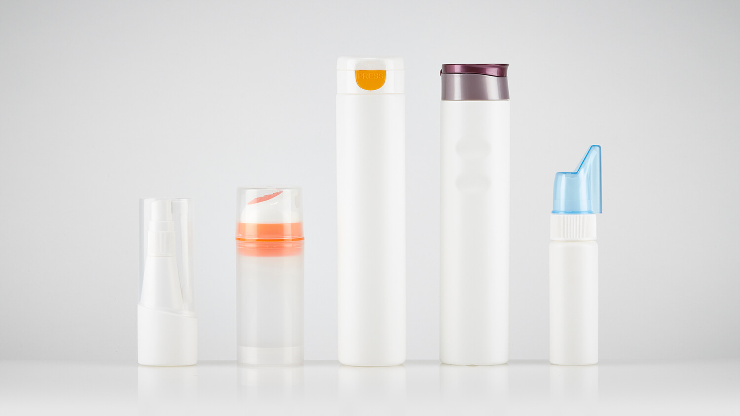 Plastic bottles in multiple sizes with assorted caps and custom color options.