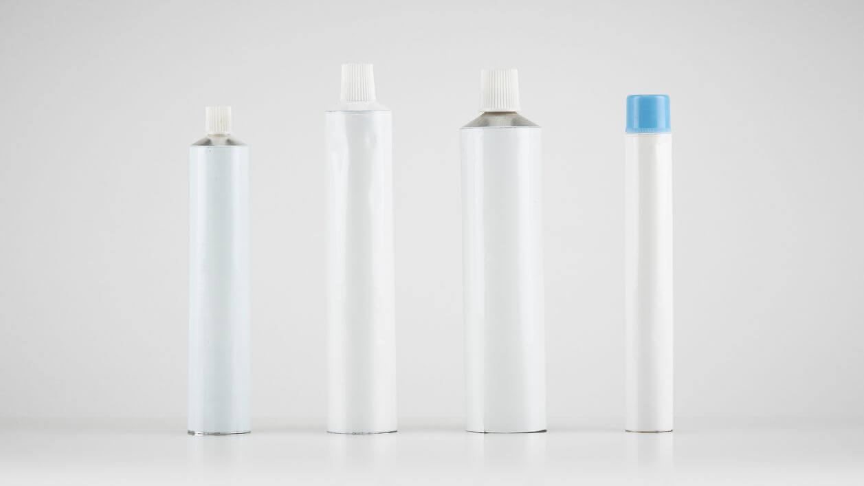 Aluminum tubes displayed in various shapes and diameters for diverse packaging needs.