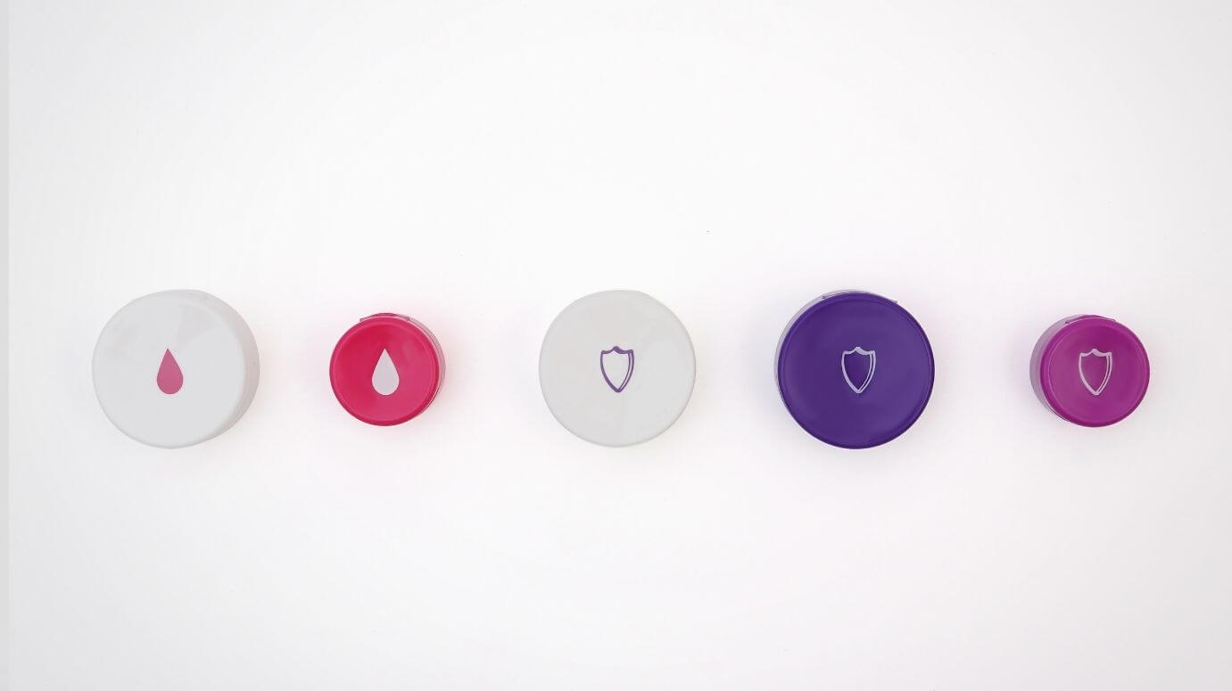 Flip-top caps with pad-printed logos in multiple sizes and colors.