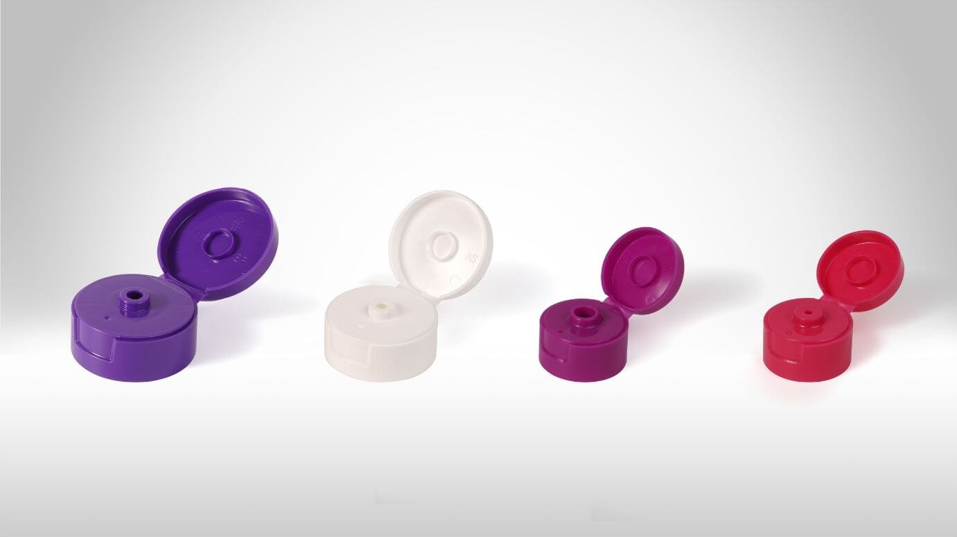Flip-top caps displayed in the open position across a range of colors.