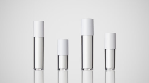 Four clear, airless sticks with white caps.