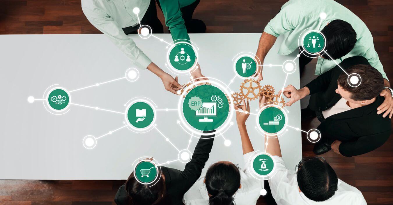 People sitting at a table going through a packaging procurement process.