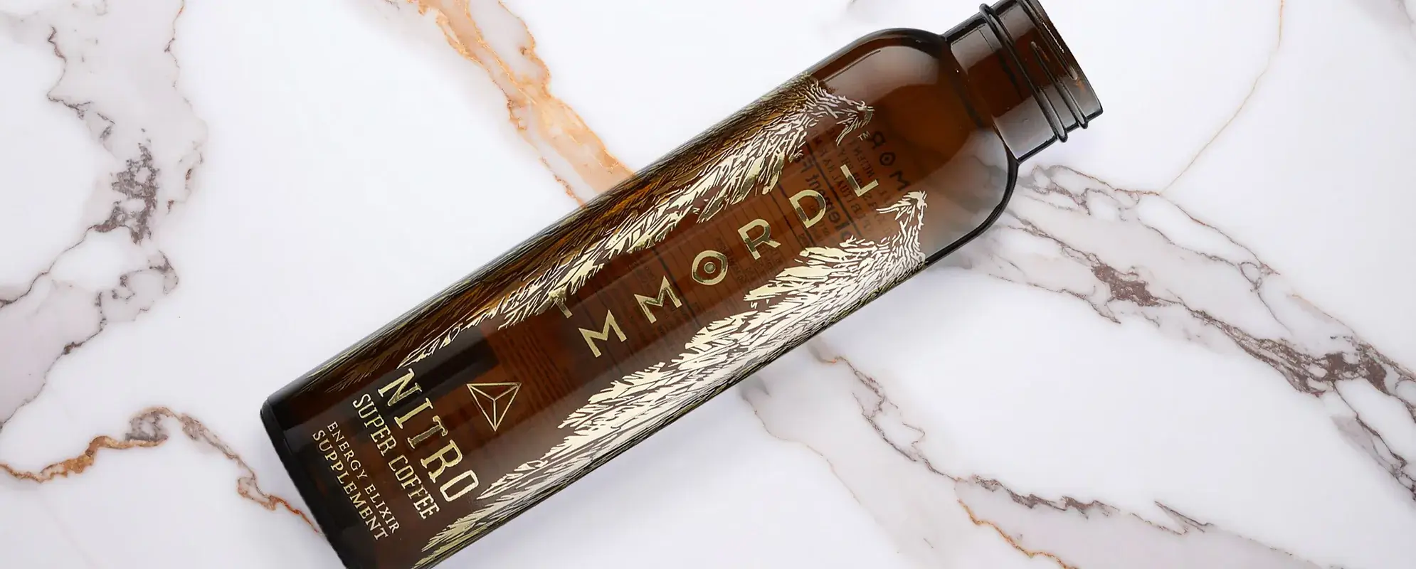 Decal decorated glass nitro cold brew coffee bottle, with logos, text, and decorations.