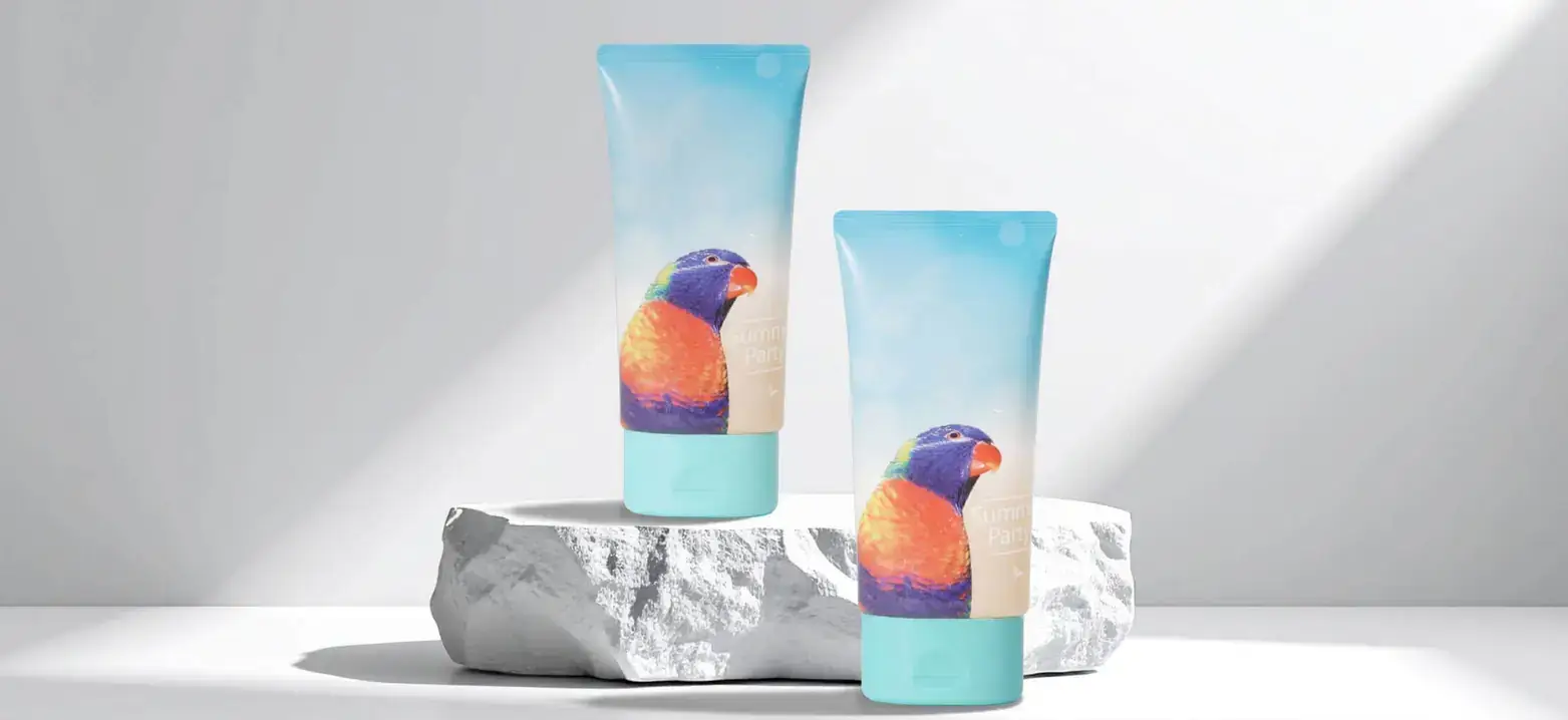 Flexographic decorations on tubes, showing realistic parrots with light blue coloring.