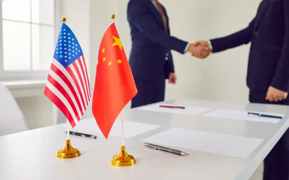 China US deal, with people shaking hands.