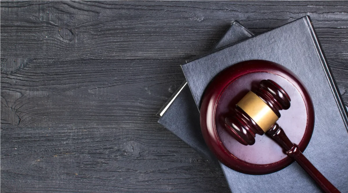 Judge hammer on legal books, representing the supreme courts' tariff rulings.