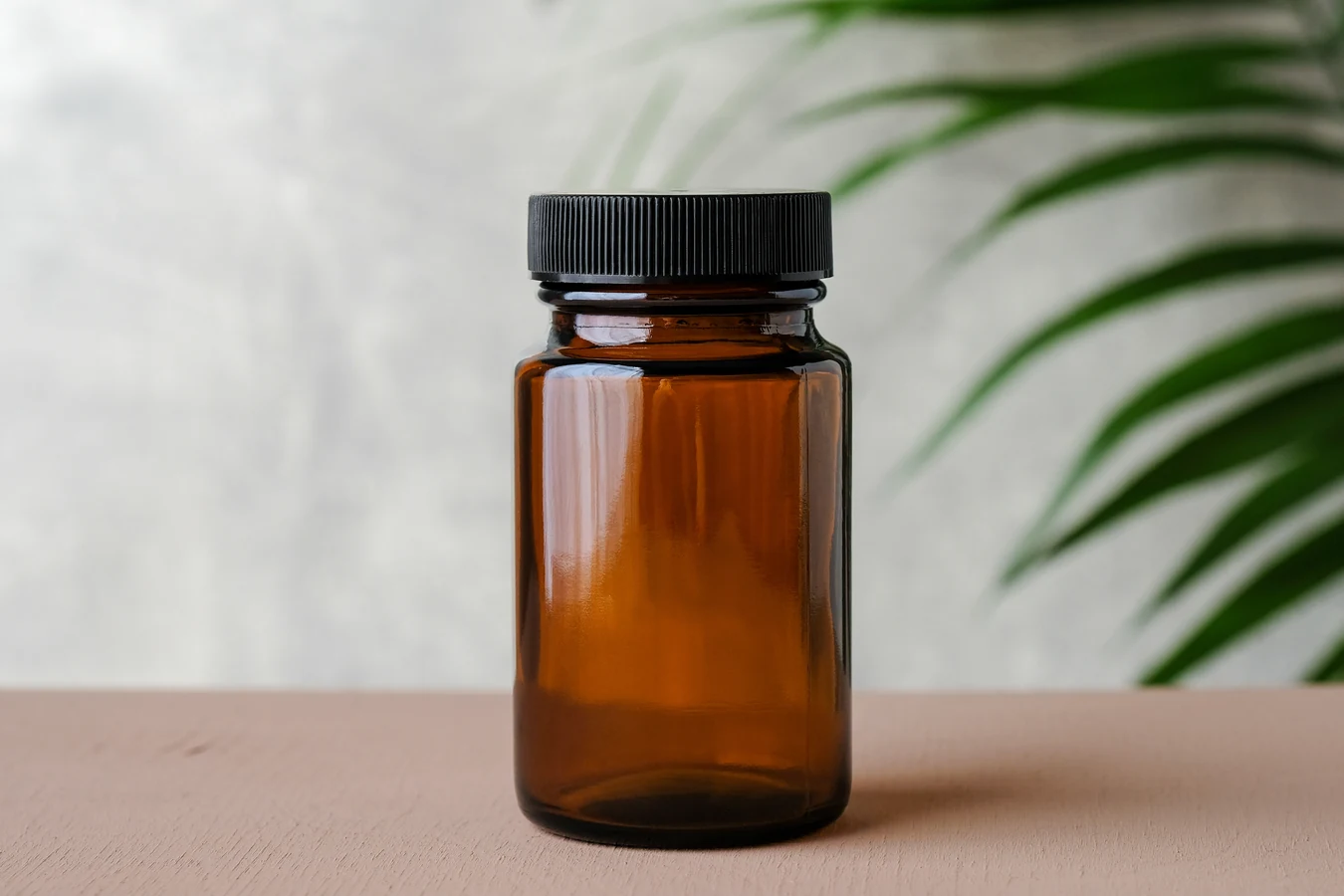 Child resistant cap on glass jar.