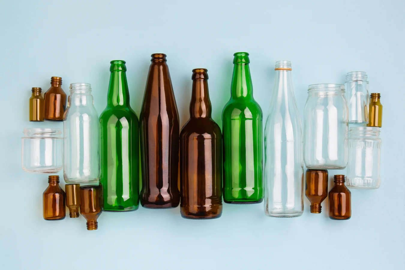 Glass bottles, jars, and vials with different compositions.