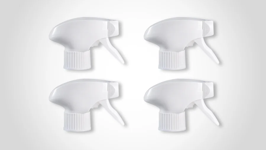 White all-plastic precompression trigger sprayers with streamlined housings, curved trigger levers, ribbed threaded bottle closures, and compact front spray nozzles.