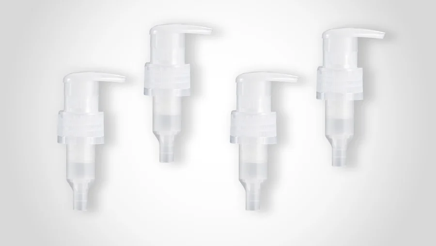 White mono-material polypropylene dispensing pumps with long lotion-style actuators, ribbed threaded collars, and translucent internal pump and stem components.